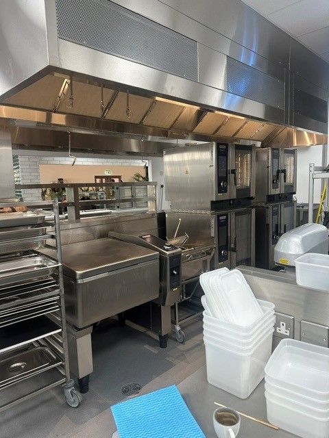 Main kitchen with extraction canopy, bratt pan and ovens