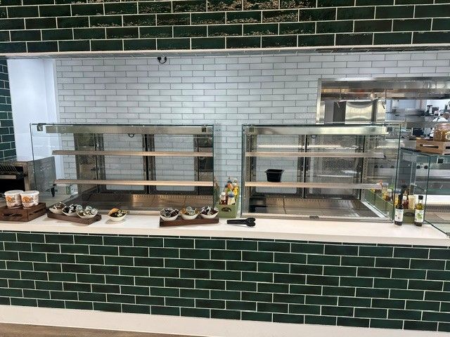 Servery counter with heated food display gantries