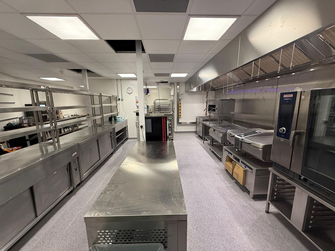 Stainless steel production kitchen with combi ovens at a Bournemouth football stadium